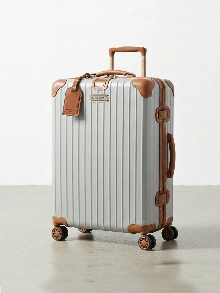 Rigid suitcase with leather trim