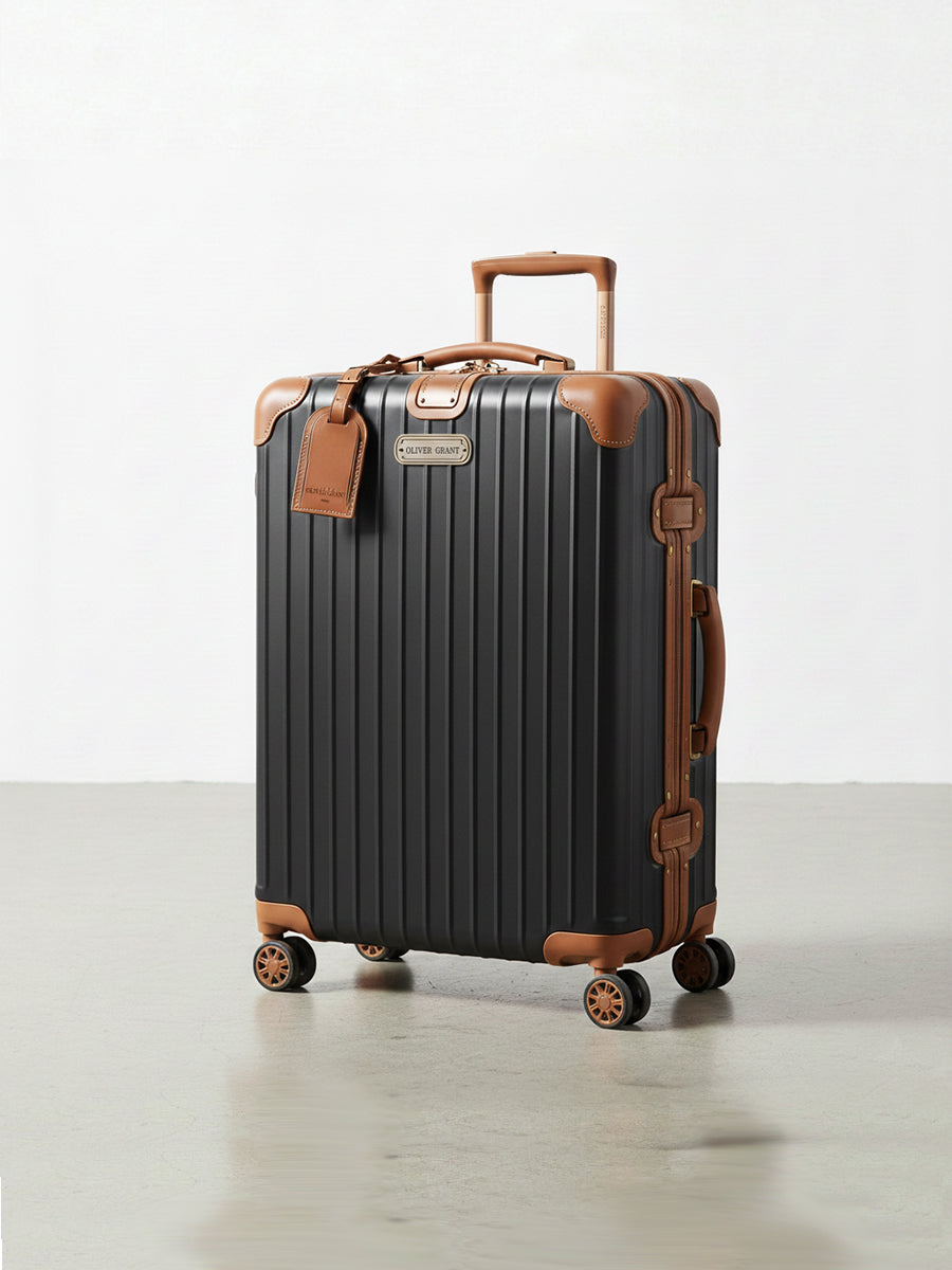 Rigid suitcase with leather trim