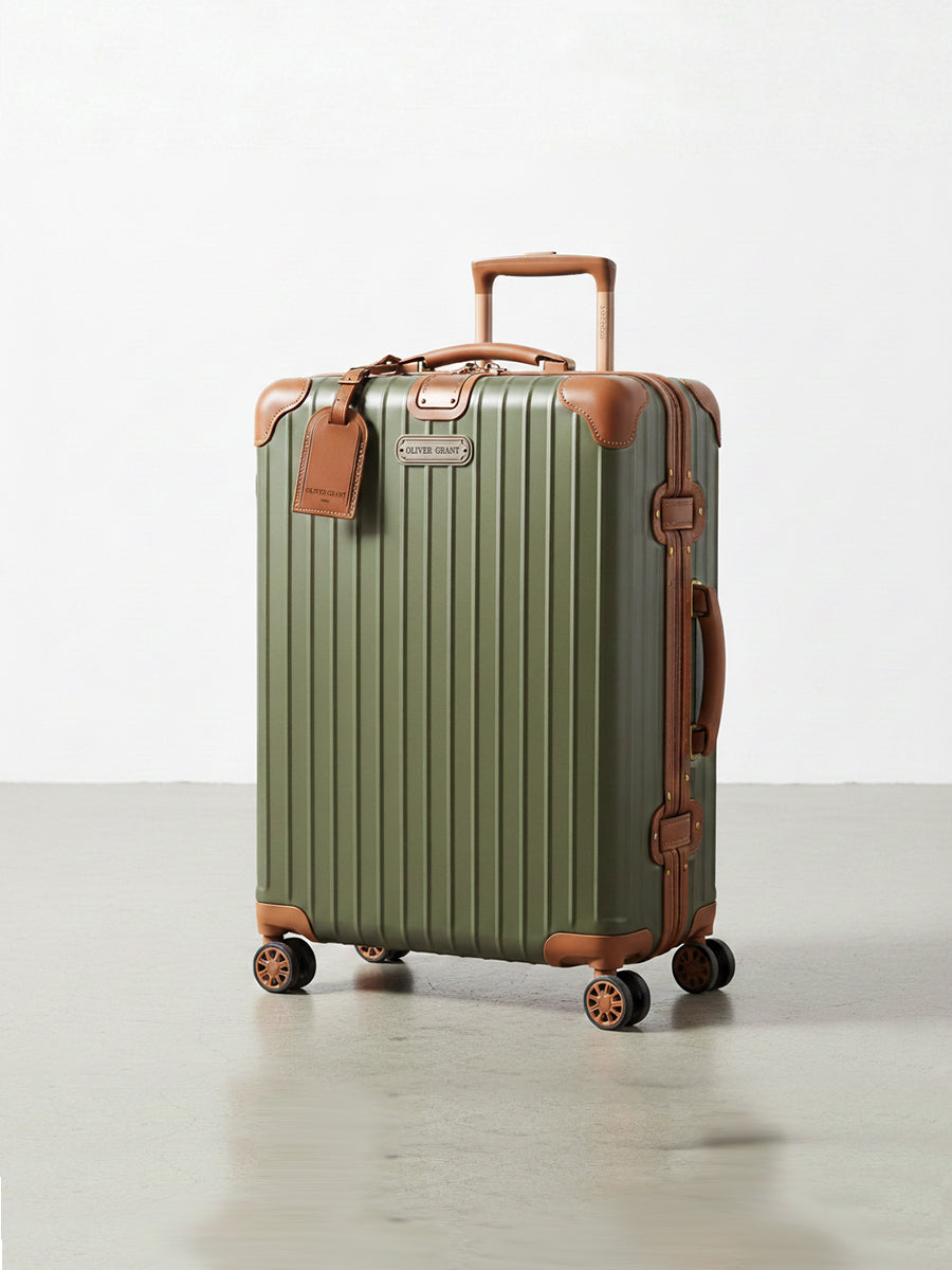 Rigid suitcase with leather trim
